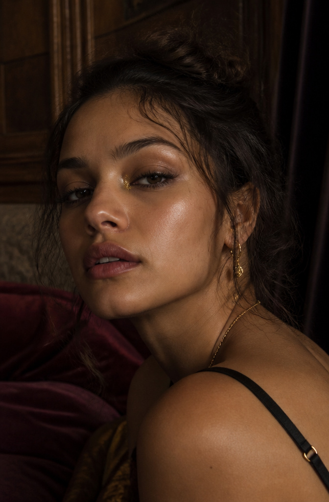 15 Euphoria Aesthetic Makeup Ideas for 2026 9 Model's eyes featuring gold leaf and smudged eyeliner.
